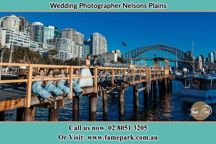 Photo of the Groom and the Bride with the entourage at the bridge Nelsons Plains NSW 2324