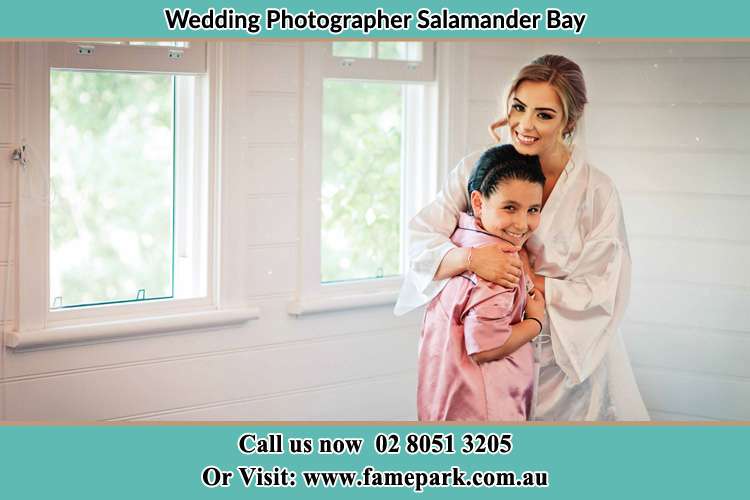 Photo of the Bride hugging the flower girl Salamander Bay NSW 2317