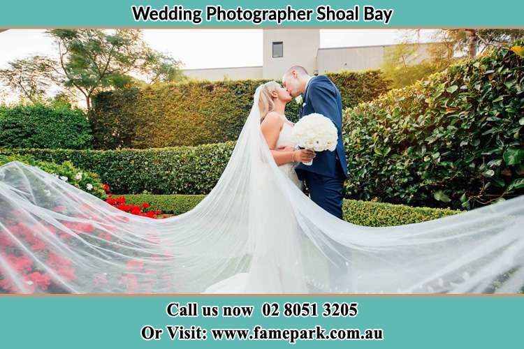 Photo of the Bride and the Groom kissing at the garden Shoal Bay NSW 2315