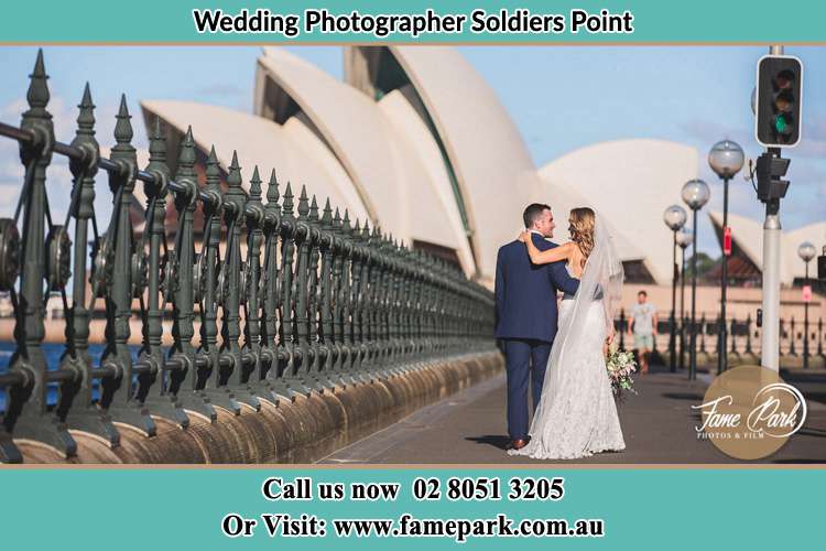 The Groom and the Bride walking towards the Sydney Grand Opera House Soldiers Point NSW 2317